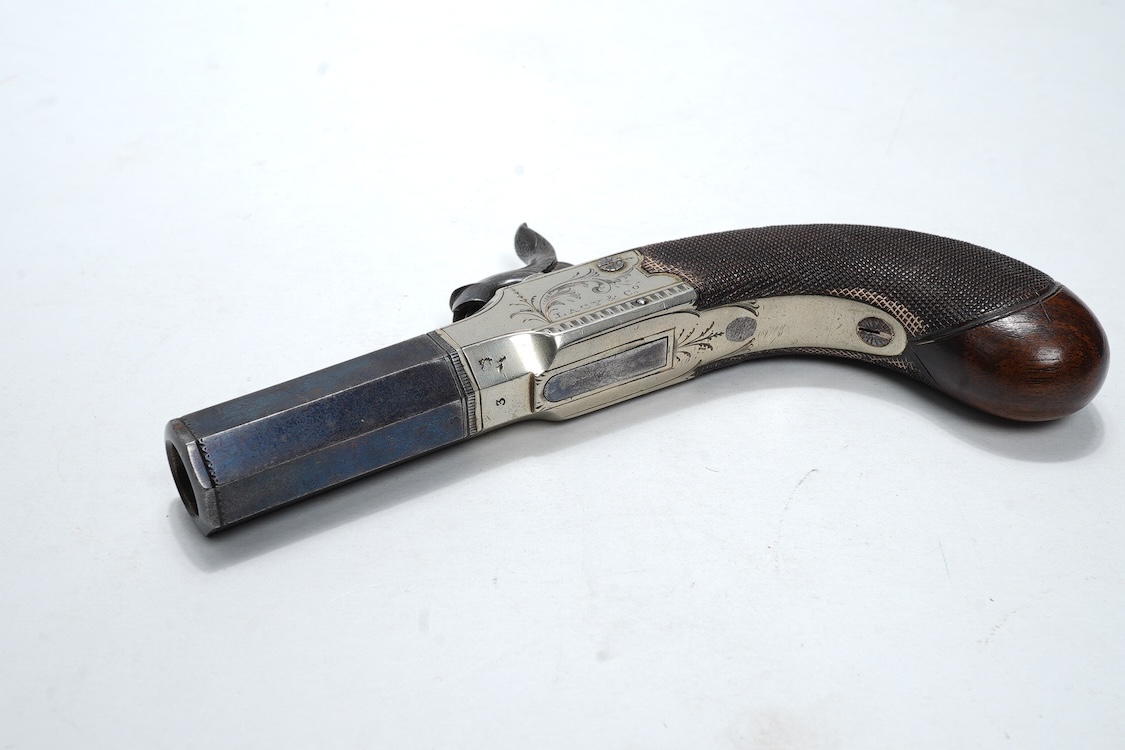 A pair of boxlock percussion pocket pistols with 4cm octagonal barrels, the frames engraved Lacy & Co., London, with London proof marks and rounded chequered walnut butts (2)